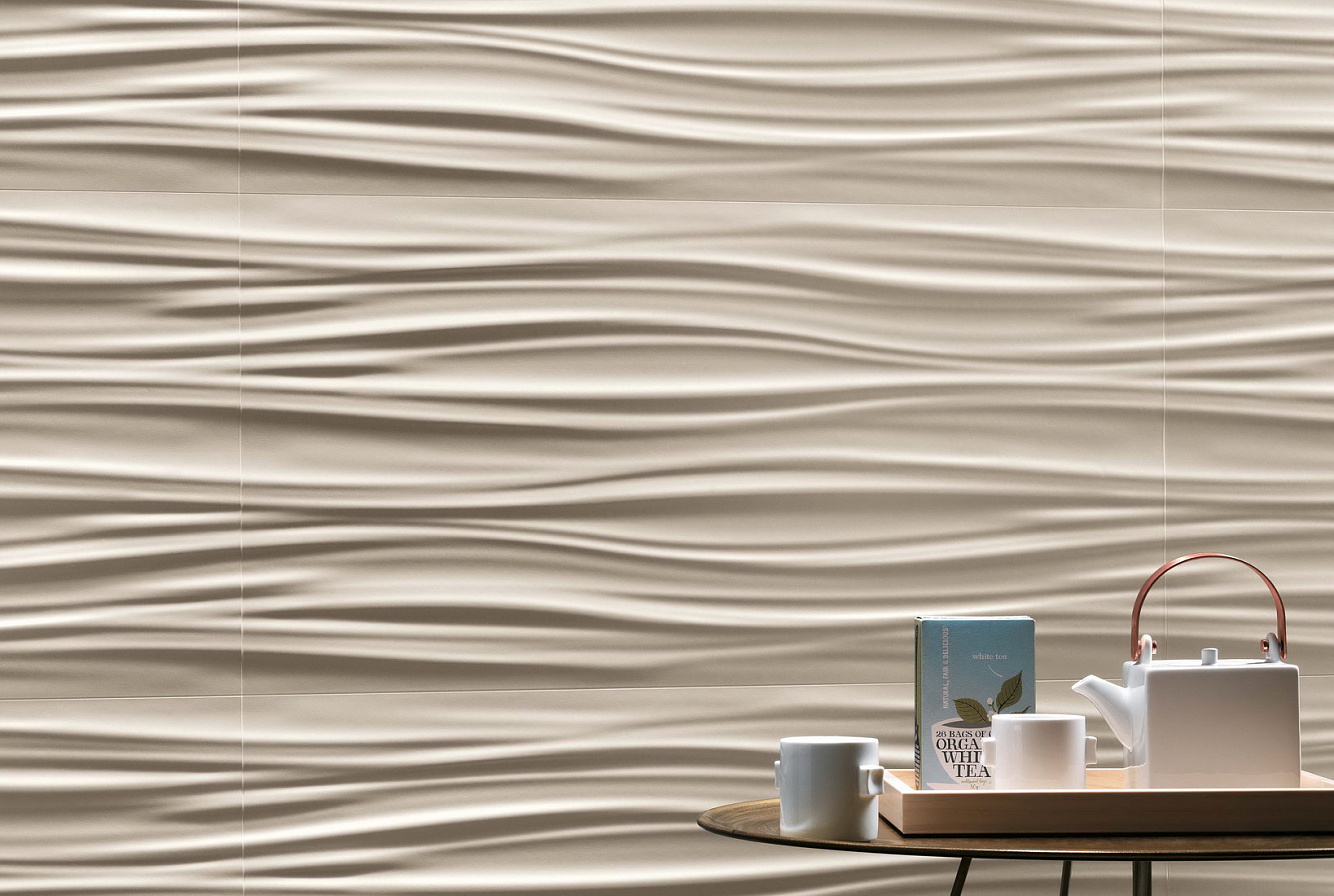 Обильная трехмерная волнистость плитки Атлас Конкорд 3d wall design ribbon sand подобна мягкой драпировке, чей рельеф оживлен деликатной светотенью.